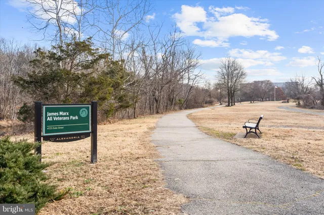 a view of a street with trees in the background