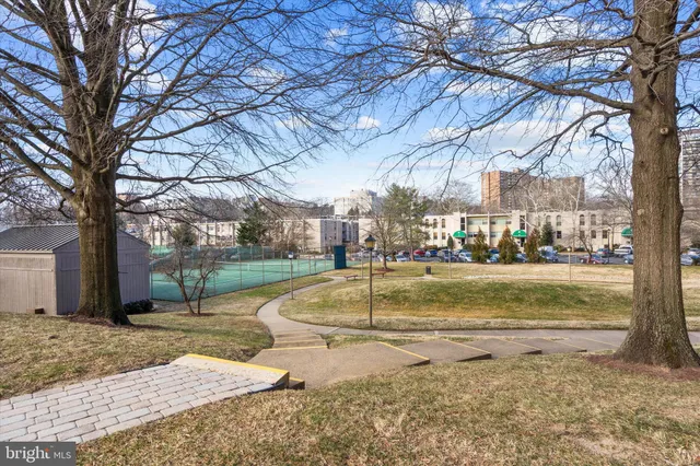 a view of a playground with basketball court
