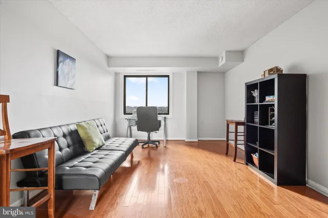 a bedroom with furniture and a book shelf