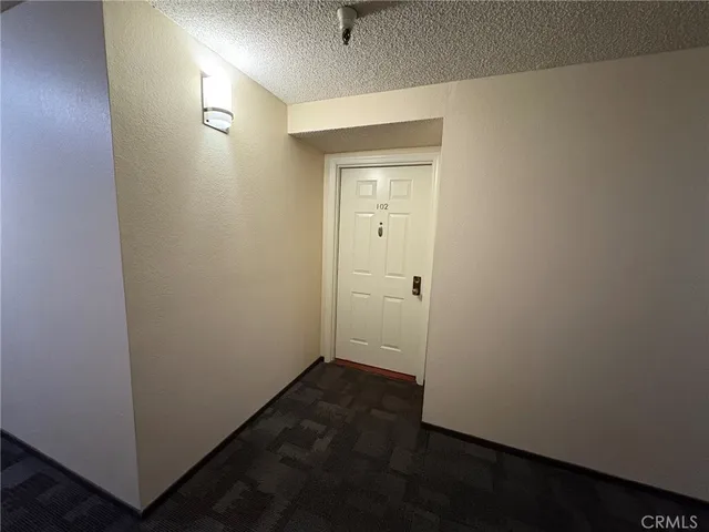 an empty room with wooden floor