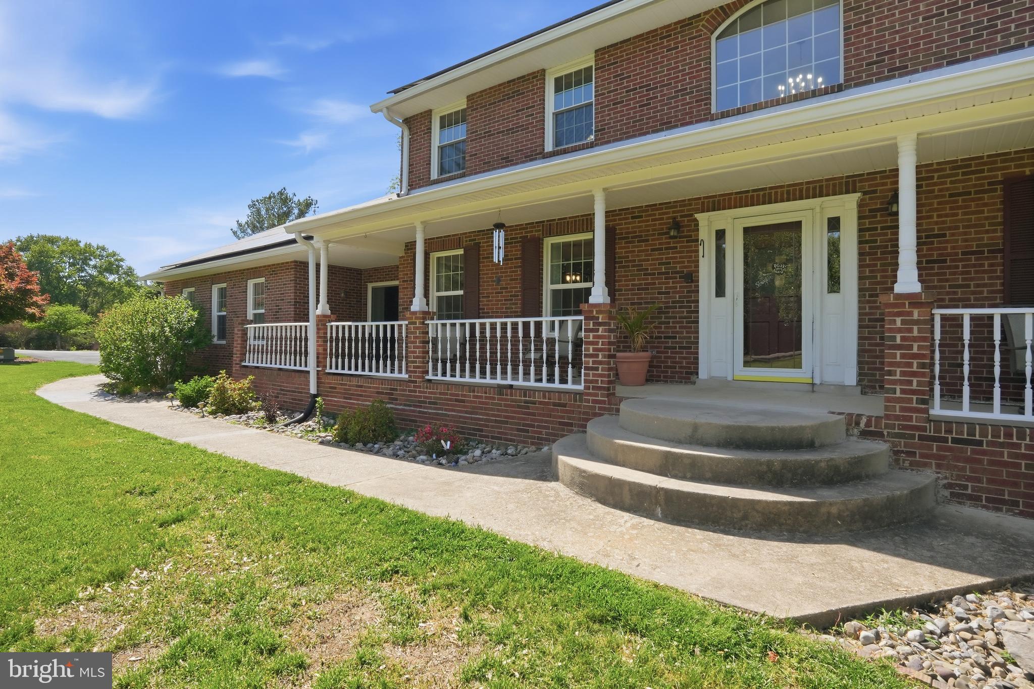 6118 Fishers Station Road Lothian, MD 20711 - Photo 2 of 62 front view of a house with a yard