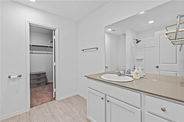 a bathroom with a sink double vanity and a mirror