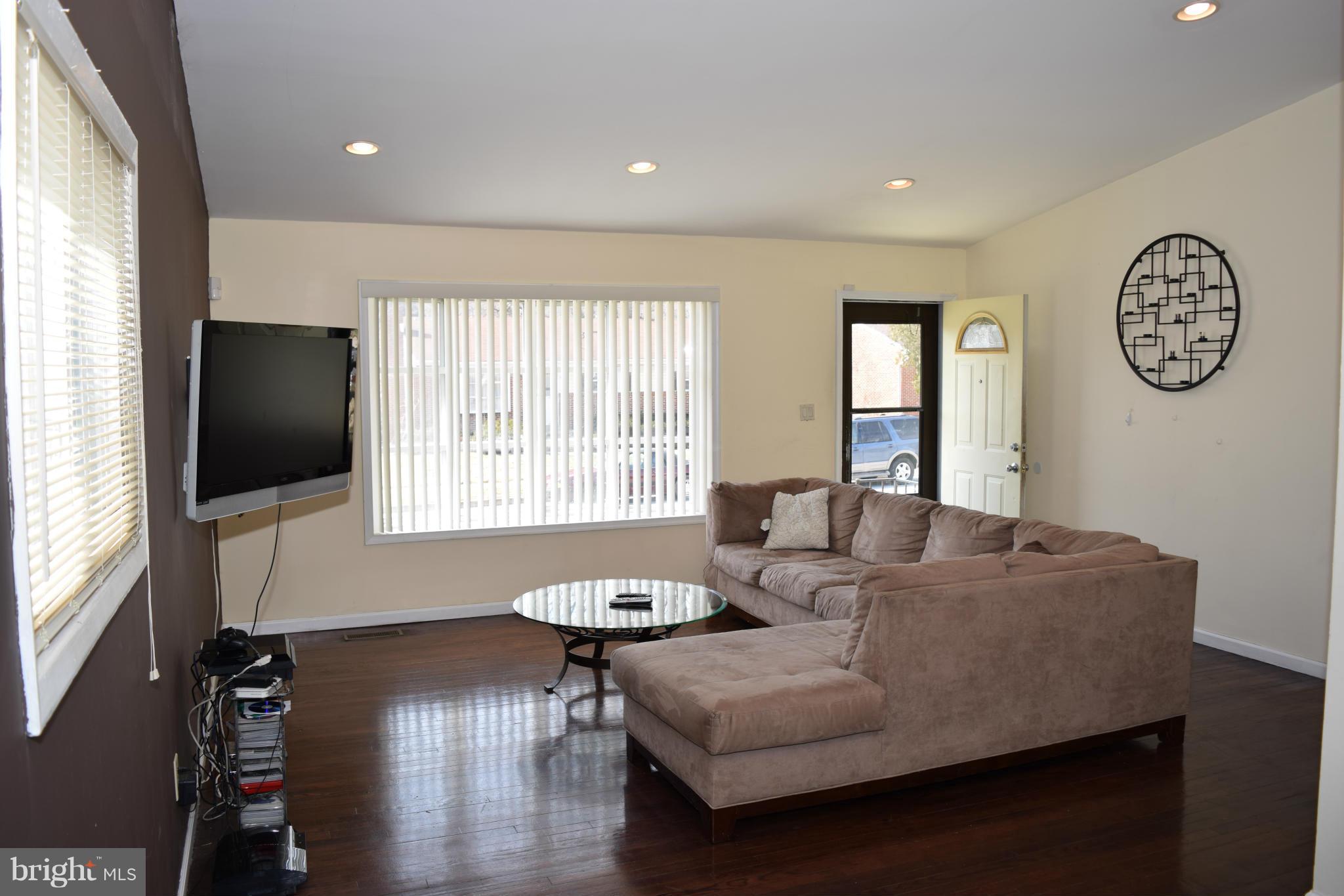 4775 Byron Road Baltimore, MD 21244 - Photo 2 of 29 a living room with furniture and a flat screen tv