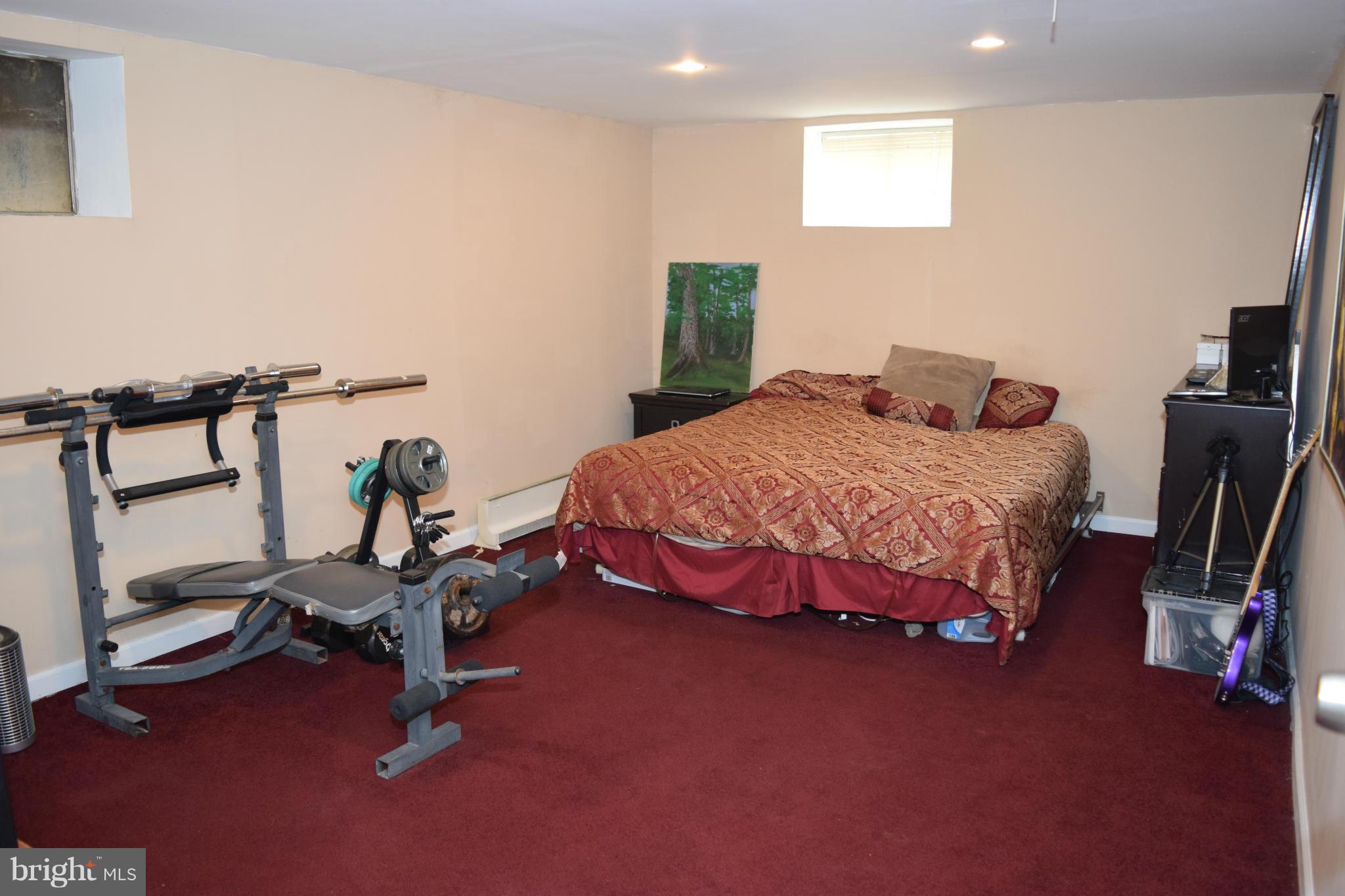 4775 Byron Road Baltimore, MD 21244 - Photo 18 of 29 a bedroom with a bed and a window