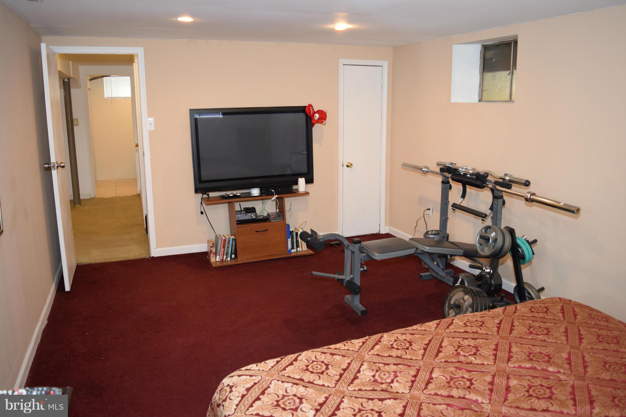 4775 Byron Road Baltimore, MD 21244 - Photo 19 of 29 a living room with furniture and a flat screen tv