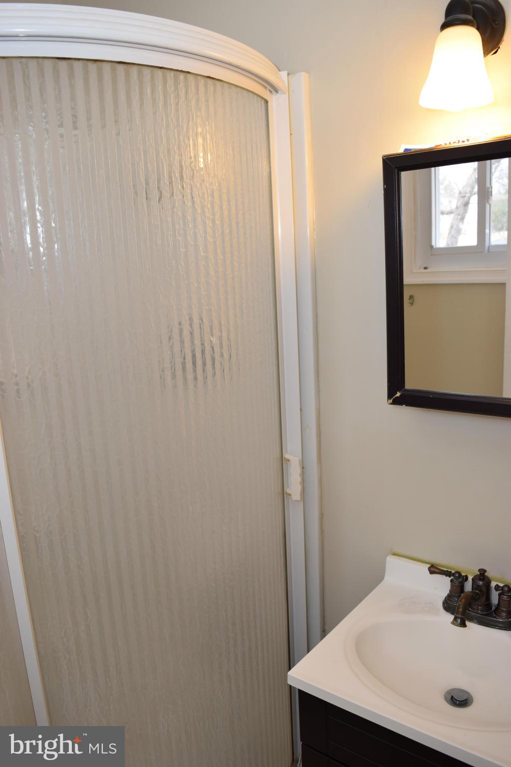 4775 Byron Road Baltimore, MD 21244 - Photo 24 of 29 a bathroom with a sink and a mirror