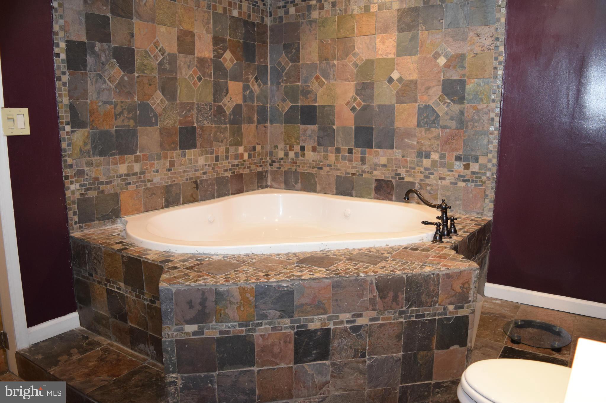 4775 Byron Road Baltimore, MD 21244 - Photo 7 of 29 a bathroom with a tub