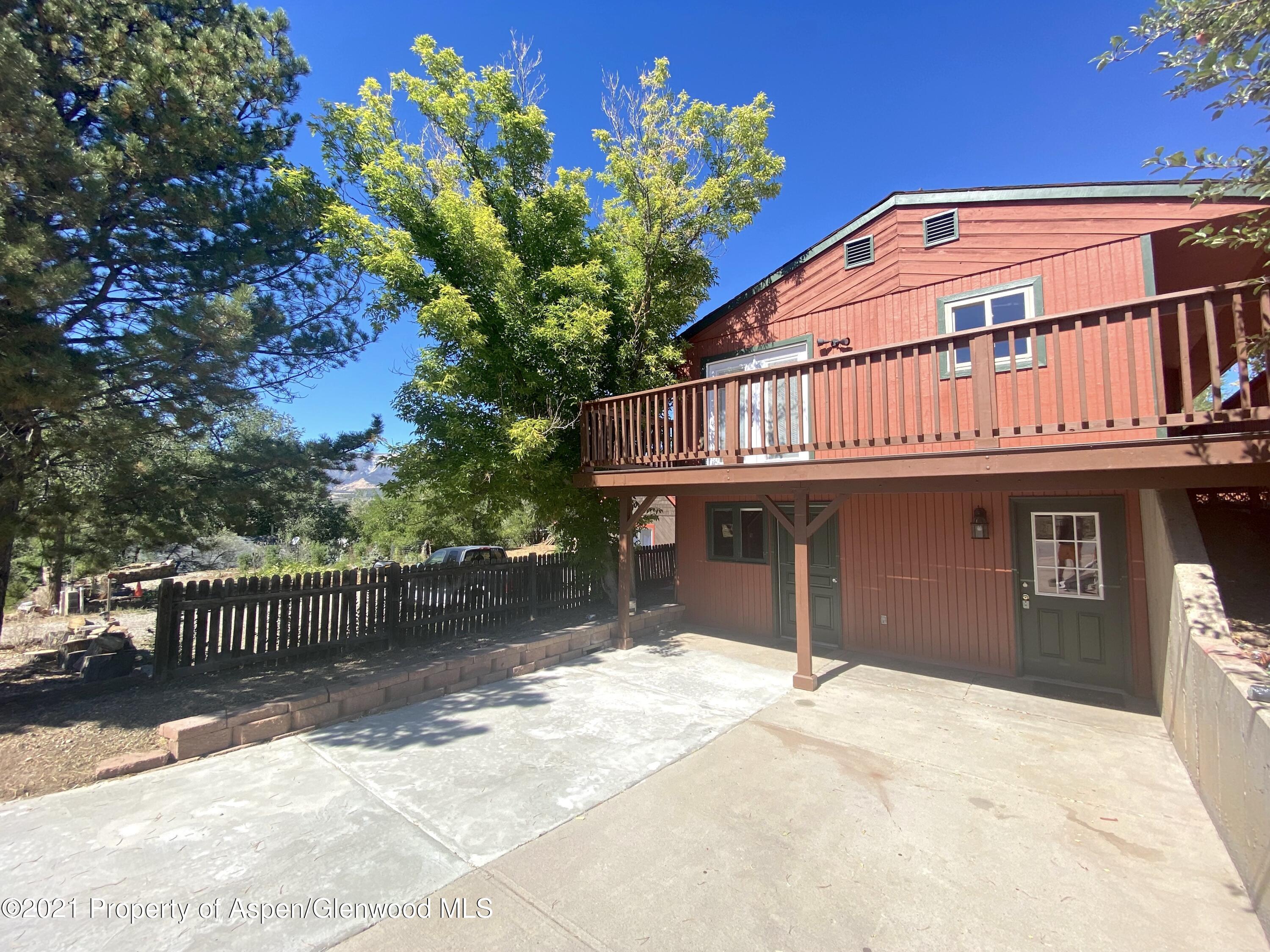 317 Clarkson Avenue Rifle, CO 81650 - Photo 1 of 17 a front view of a house