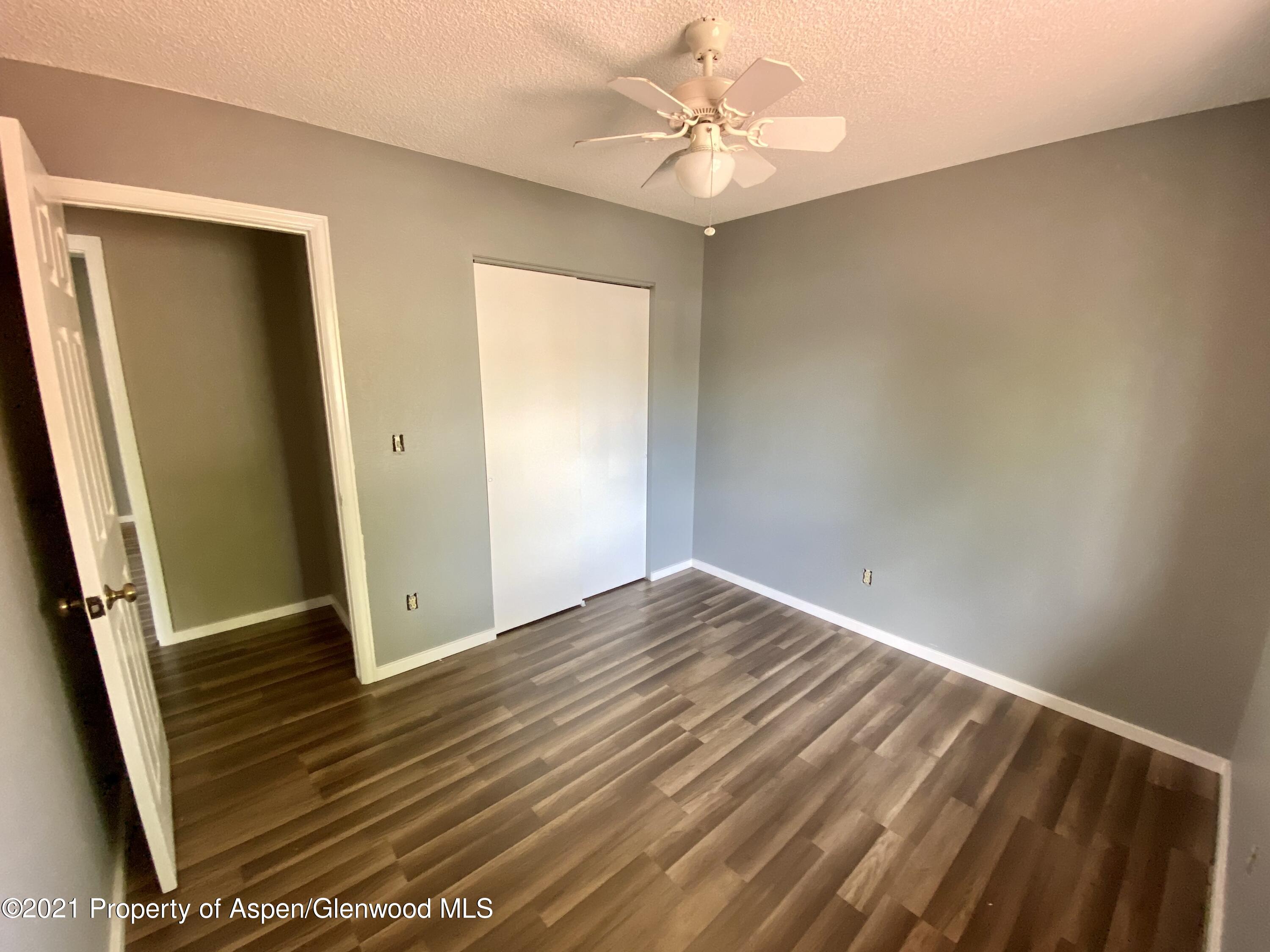 317 Clarkson Avenue Rifle, CO 81650 - Photo 11 of 17 wooden floor in an empty room