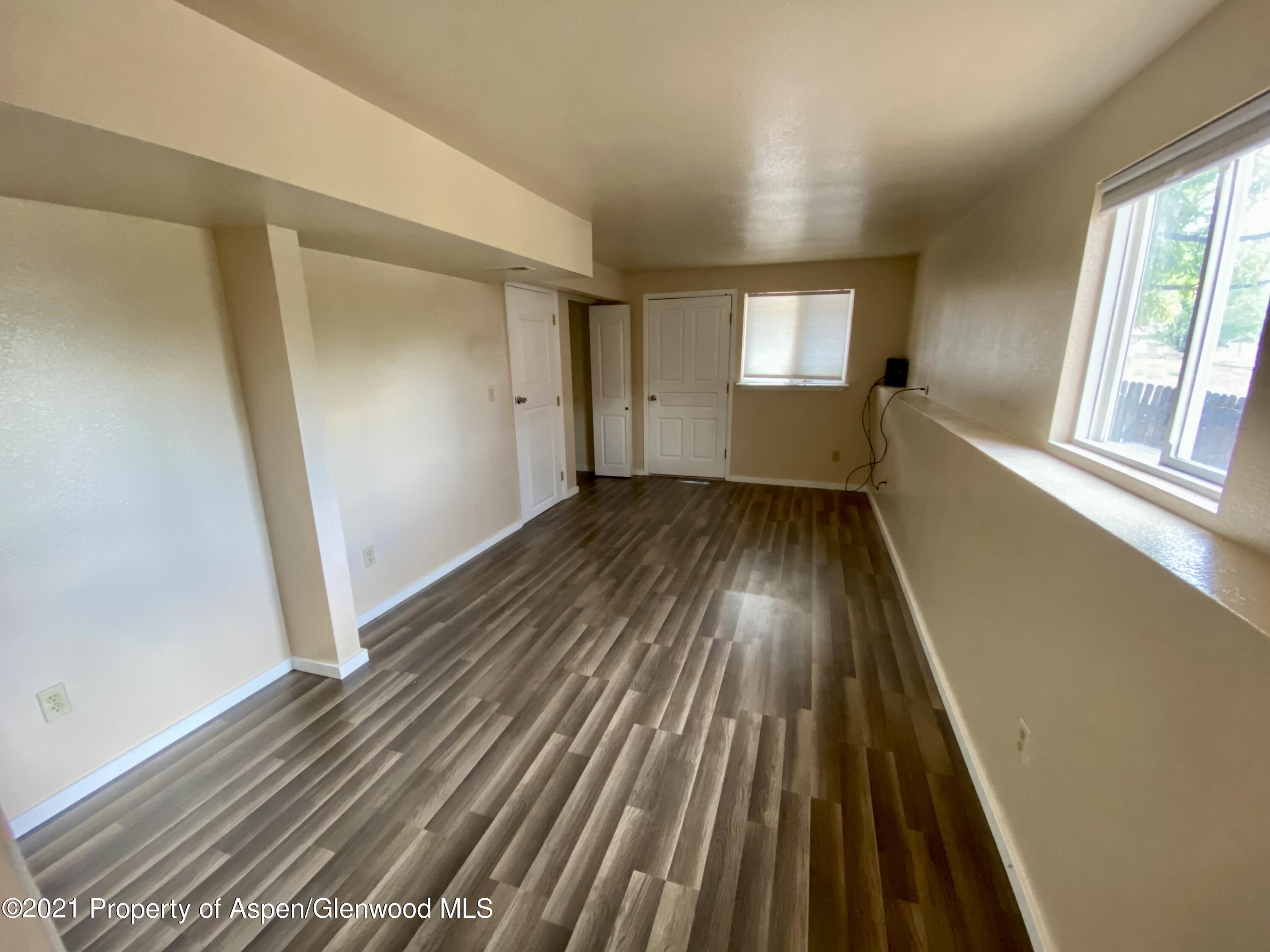 317 Clarkson Avenue Rifle, CO 81650 - Photo 13 of 17 wooden floor in a hall with an entryway
