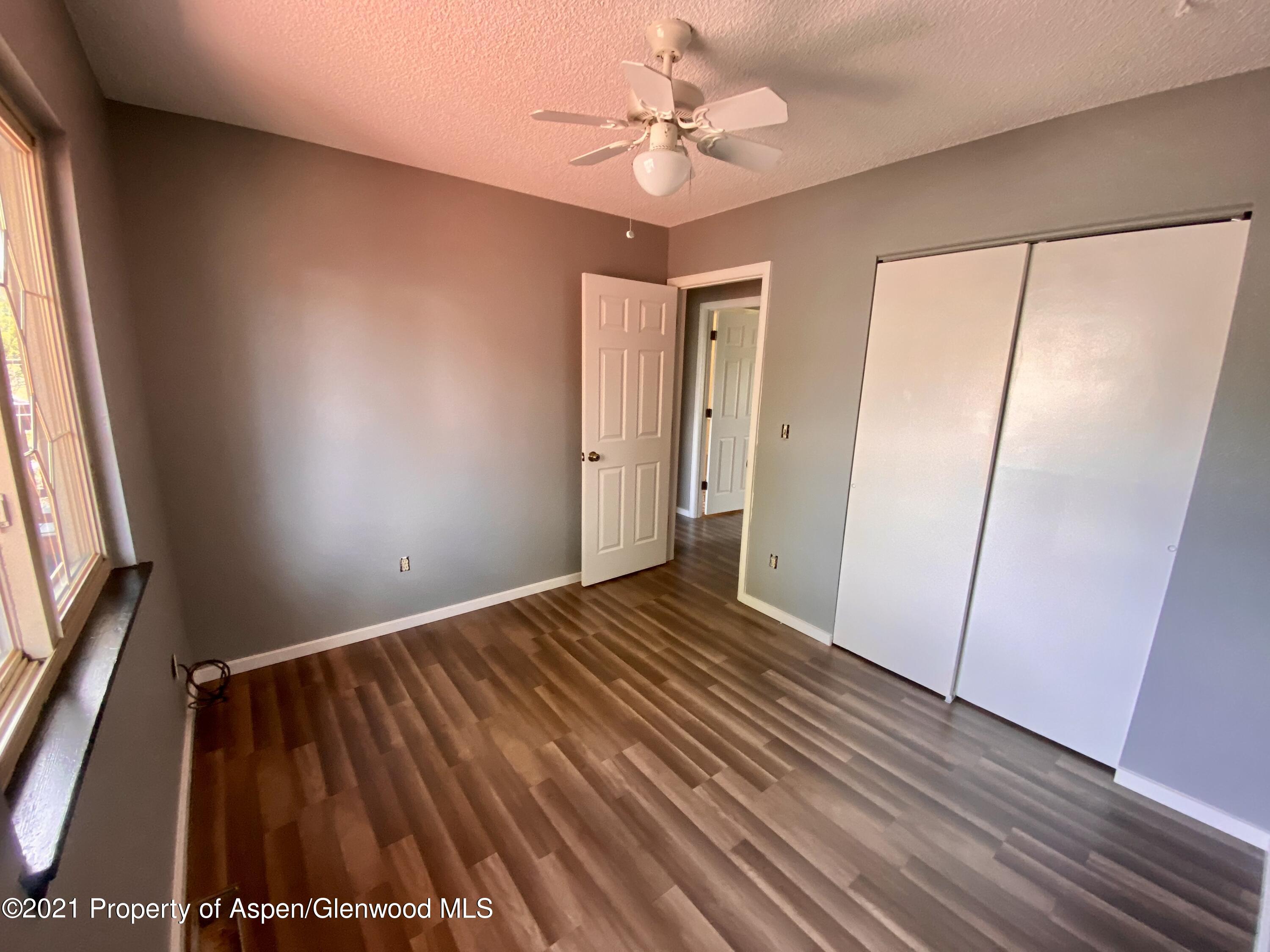 317 Clarkson Avenue Rifle, CO 81650 - Photo 14 of 17 a view of an empty room with a window