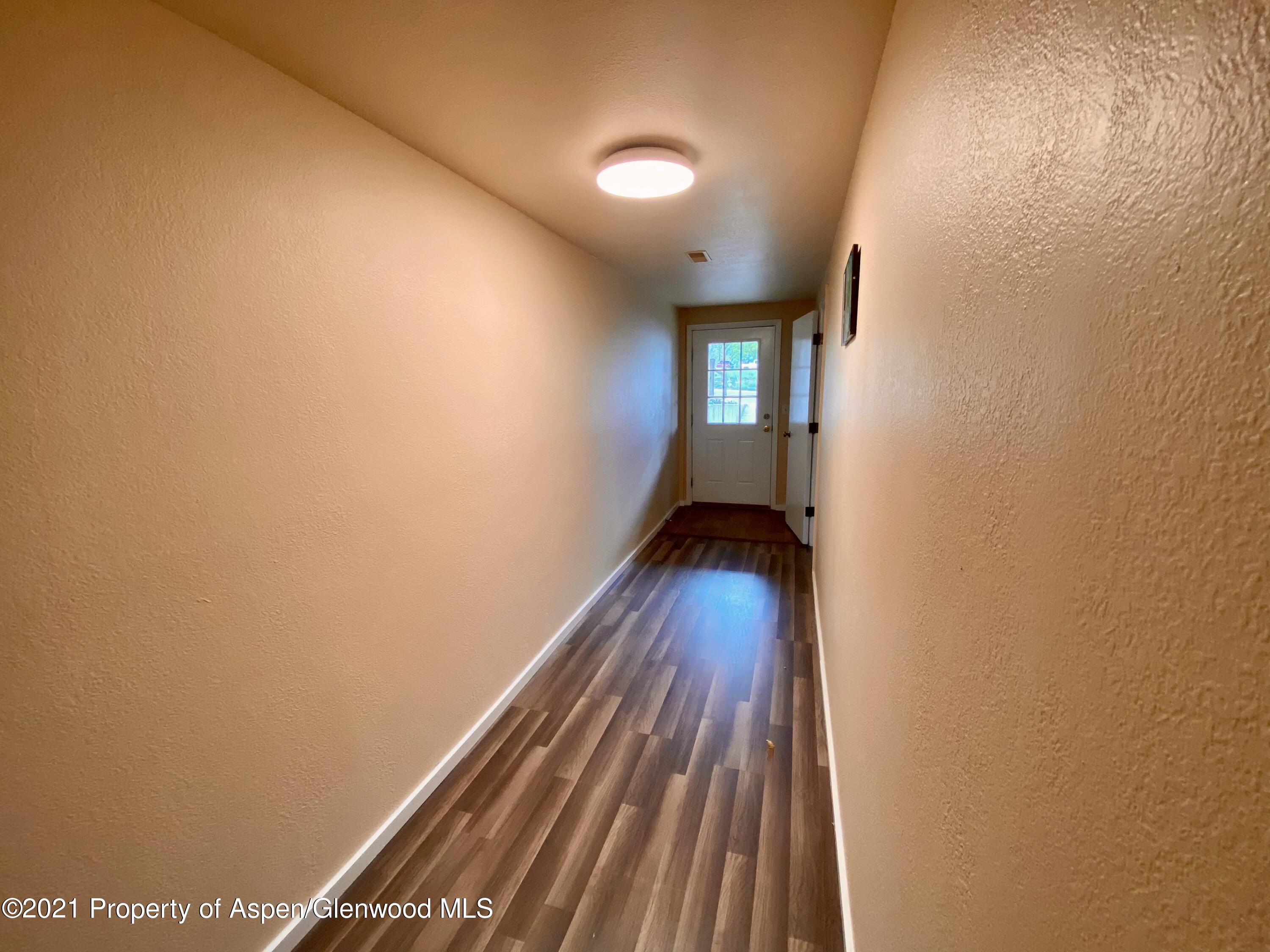 317 Clarkson Avenue Rifle, CO 81650 - Photo 15 of 17 a view of entryway with wooden floor