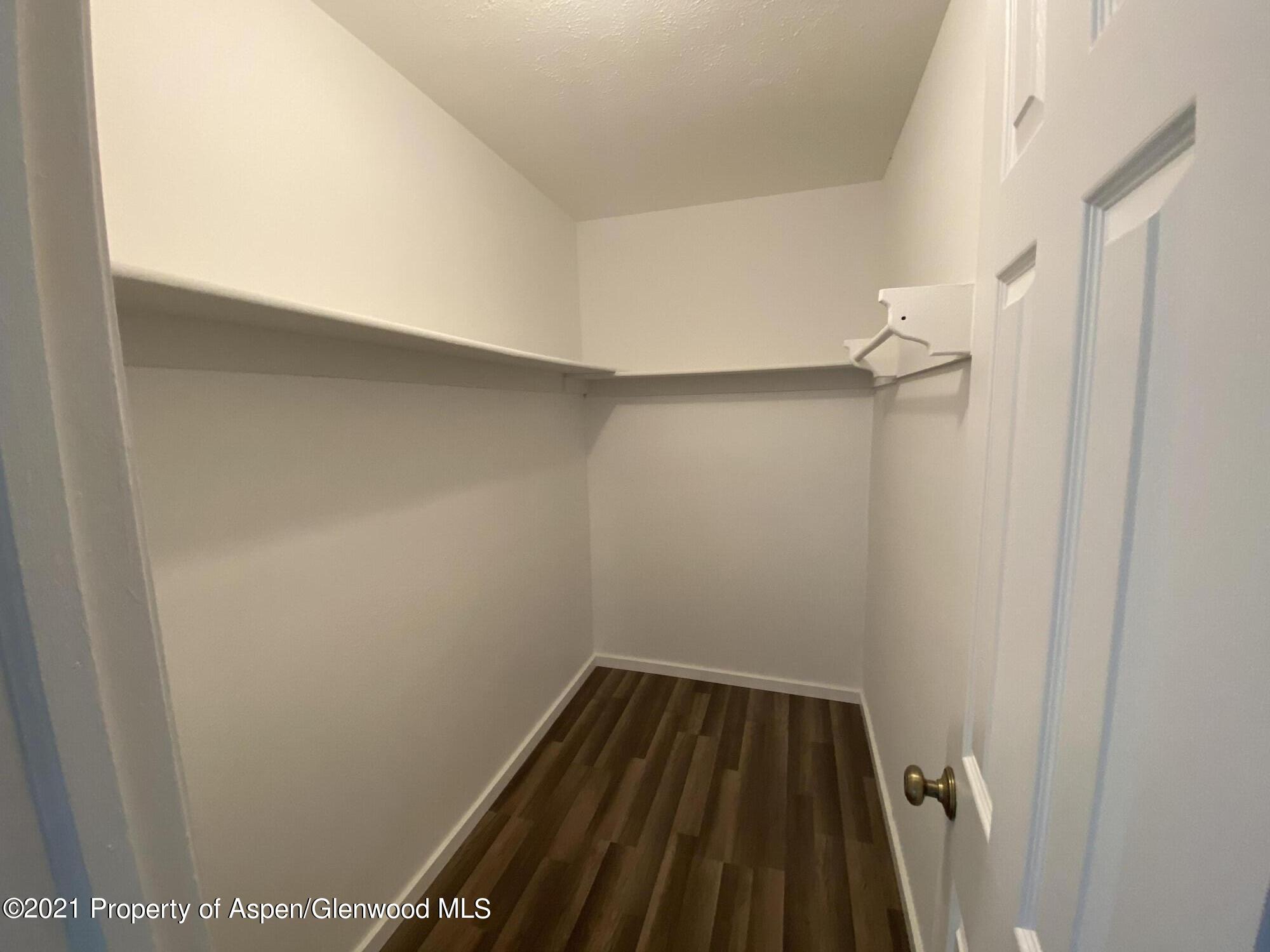 317 Clarkson Avenue Rifle, CO 81650 - Photo 9 of 17 a view of a room with wooden floor