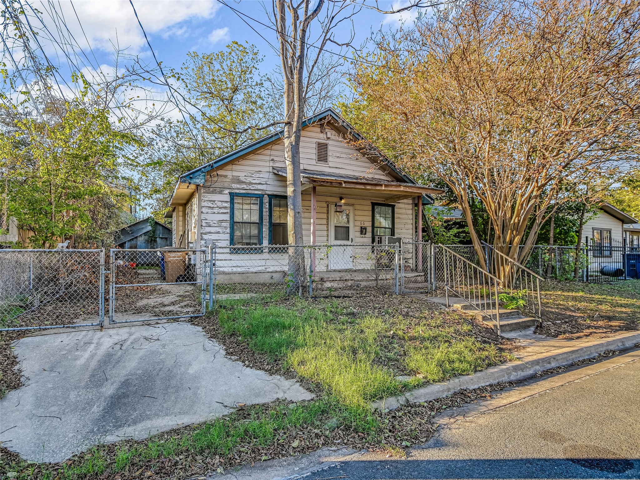 66 Cross Street Austin, TX 78702 - Photo 1 of 20 a front view of a house with garden