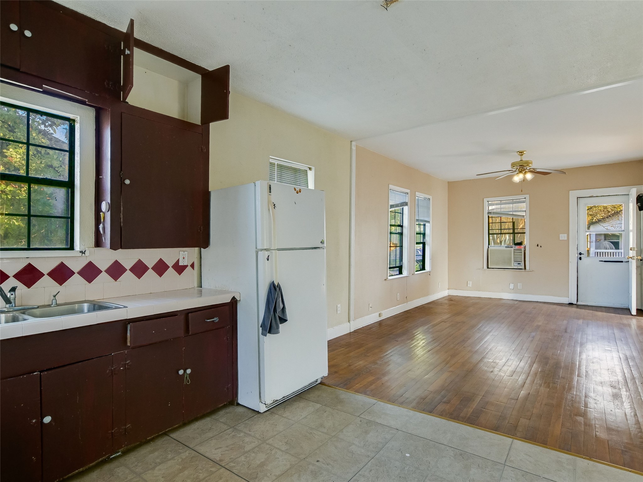 66 Cross Street Austin, TX 78702 - Photo 12 of 20 a kitchen with cabinets and wooden floor