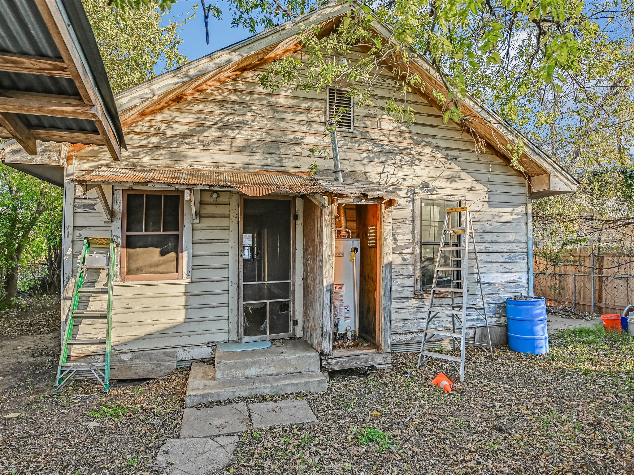 66 Cross Street Austin, TX 78702 - Photo 13 of 20 a front view of a house with outdoor seating
