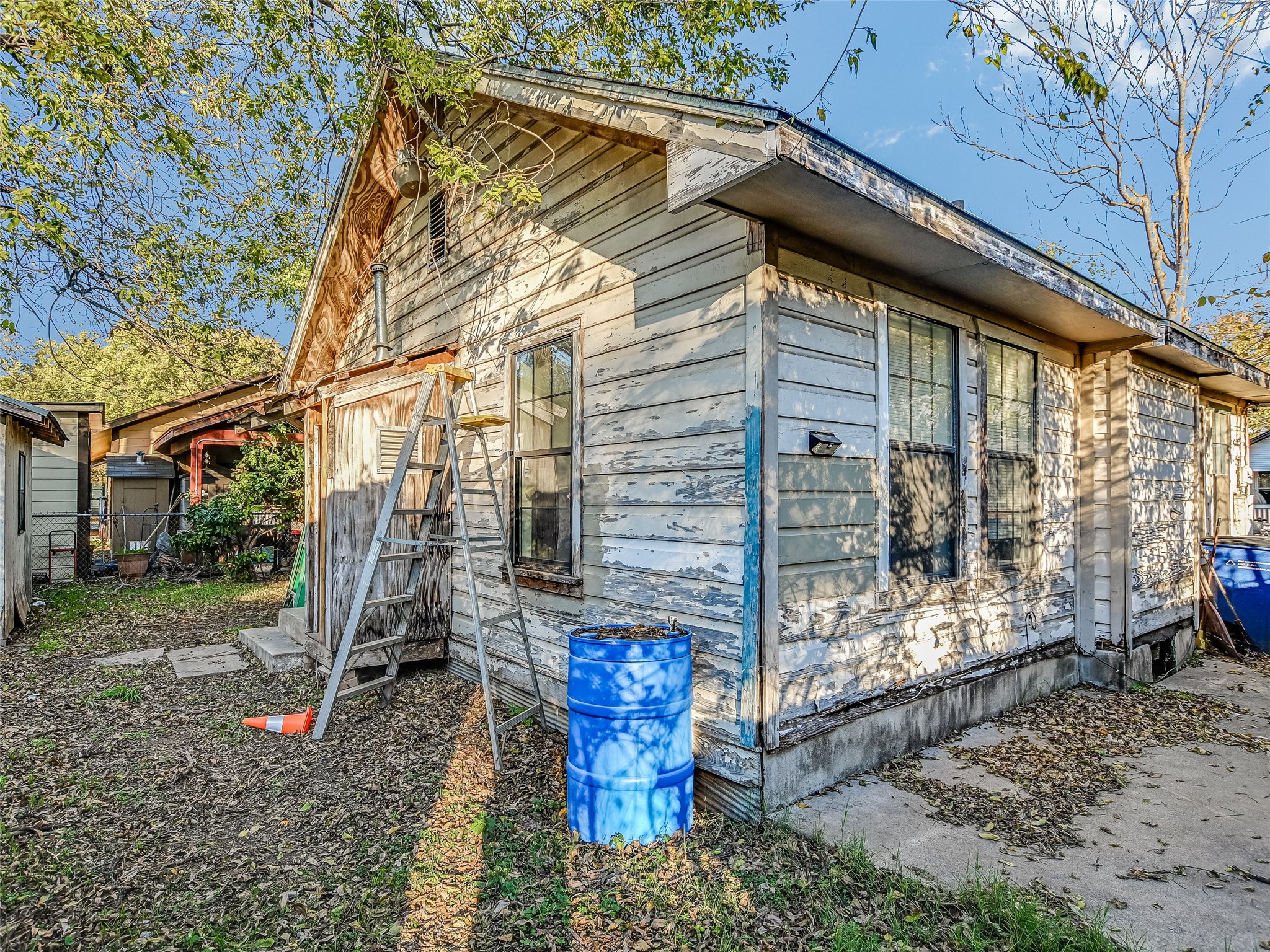 66 Cross Street Austin, TX 78702 - Photo 17 of 20 a backyard of a house with outdoor seating