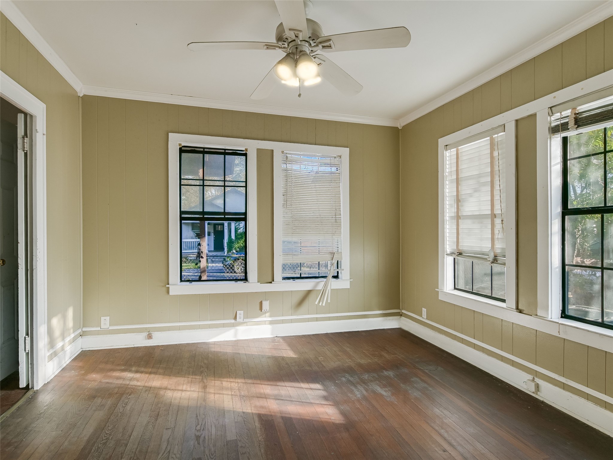 66 Cross Street Austin, TX 78702 - Photo 4 of 20 a view of an empty room with a window and wooden floor