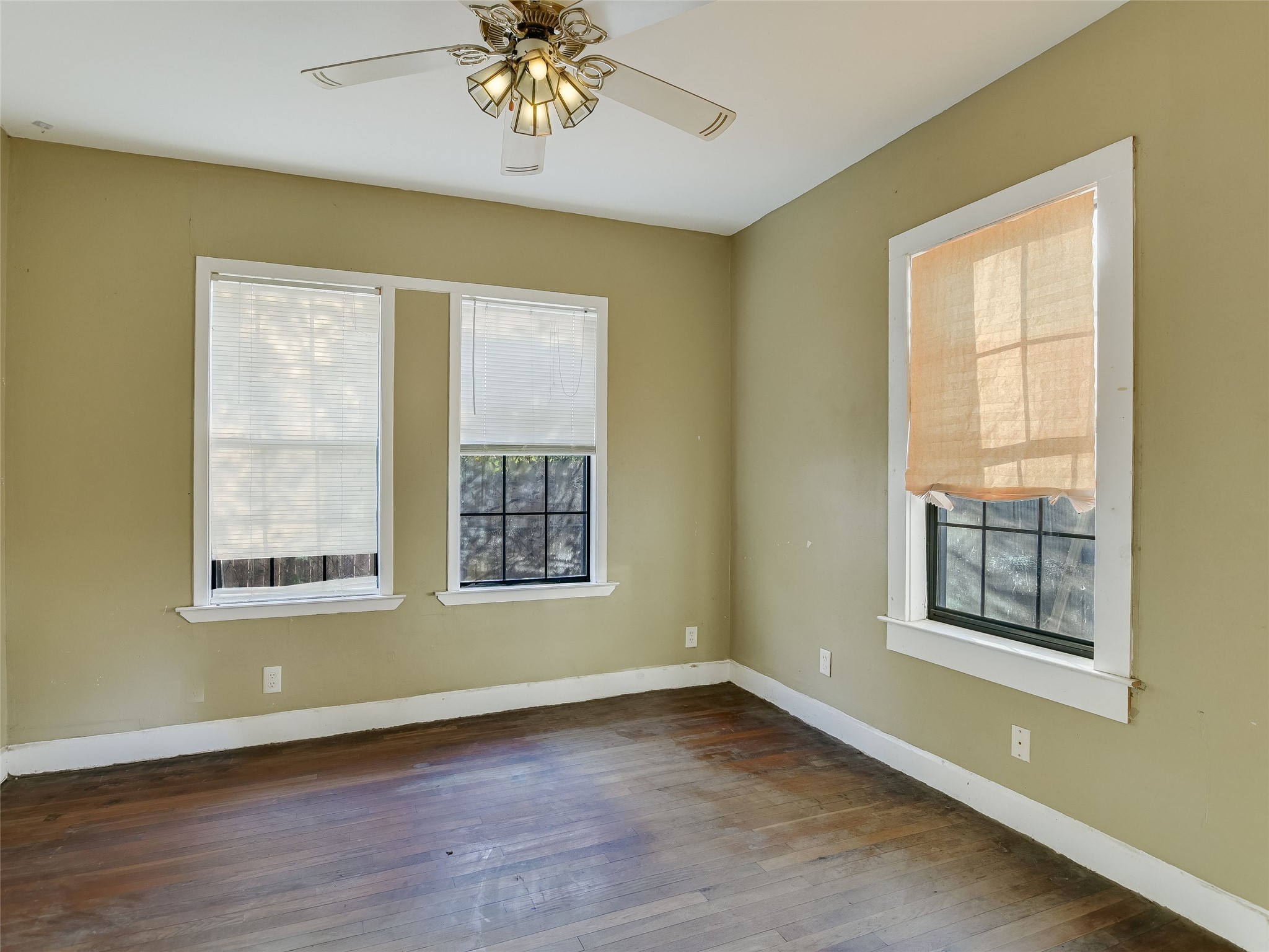 66 Cross Street Austin, TX 78702 - Photo 7 of 20 a view of an empty room with a window and wooden floor