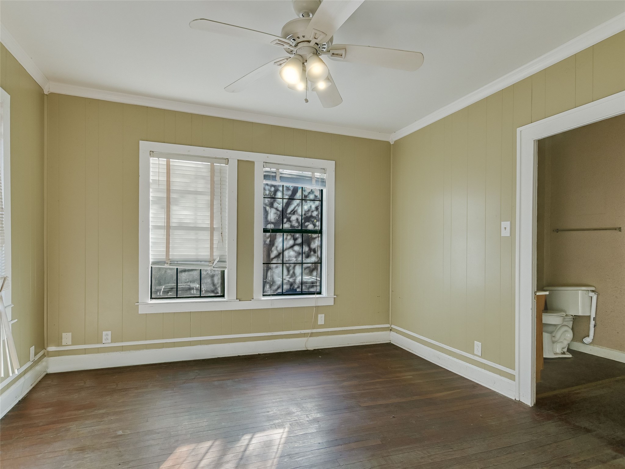 66 Cross Street Austin, TX 78702 - Photo 8 of 20 a view of an empty room with window and wooden floor