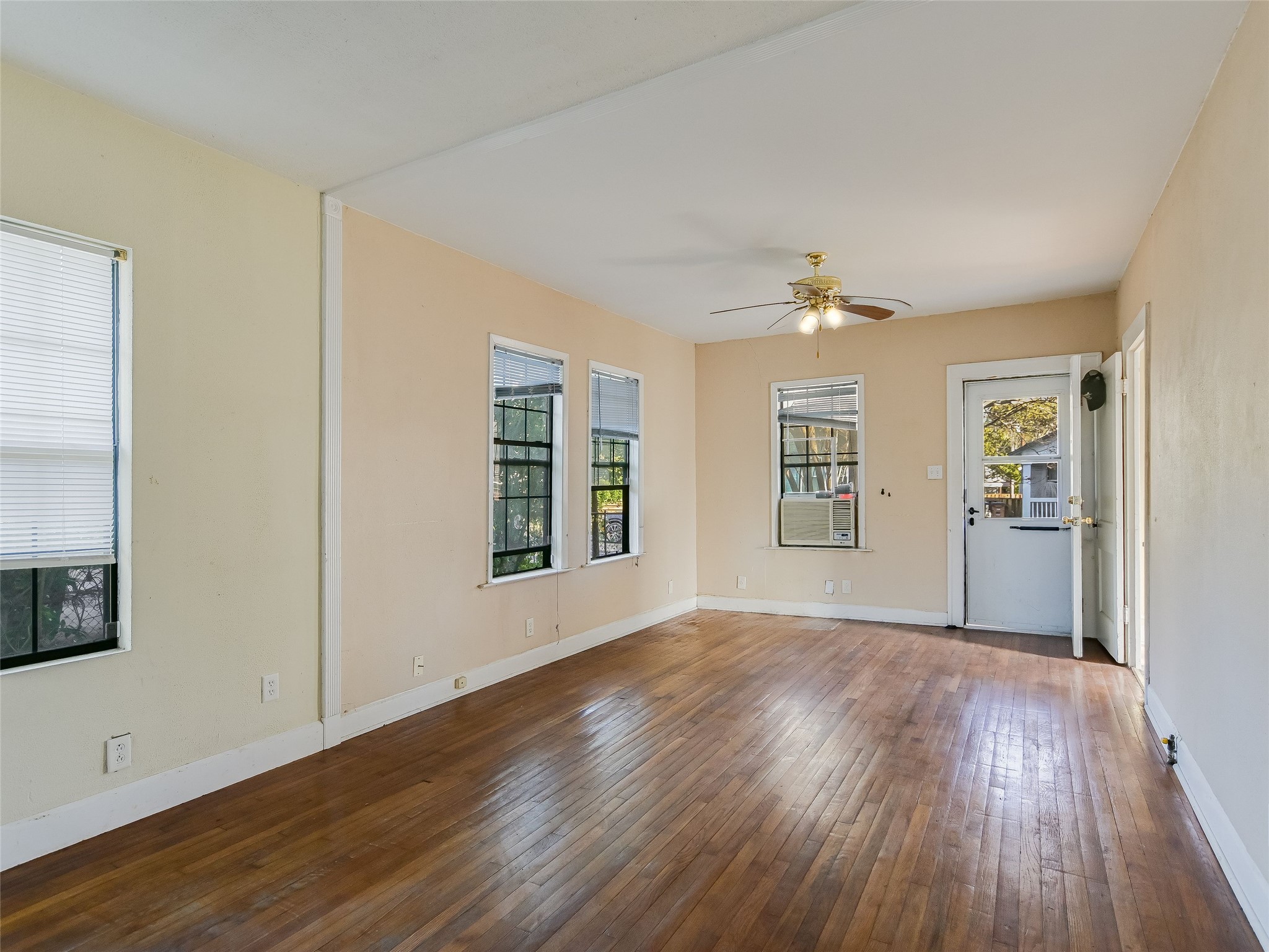 66 Cross Street Austin, TX 78702 - Photo 10 of 20 wooden floor in an empty room with a window