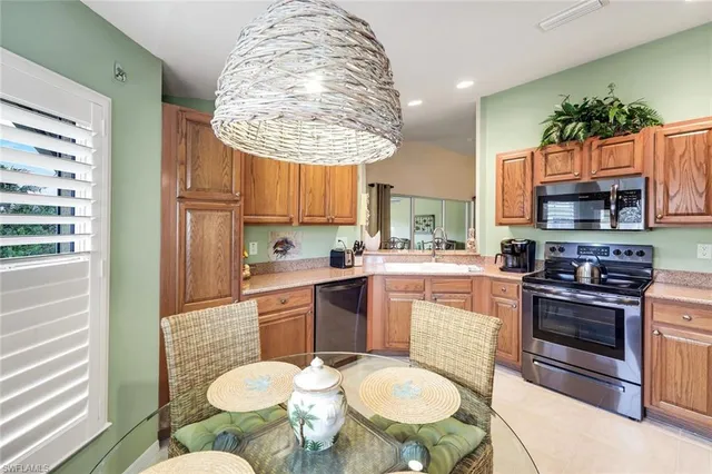 a kitchen with a sink stove and refrigerator