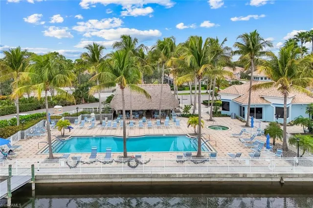 a view of a swimming pool with a patio