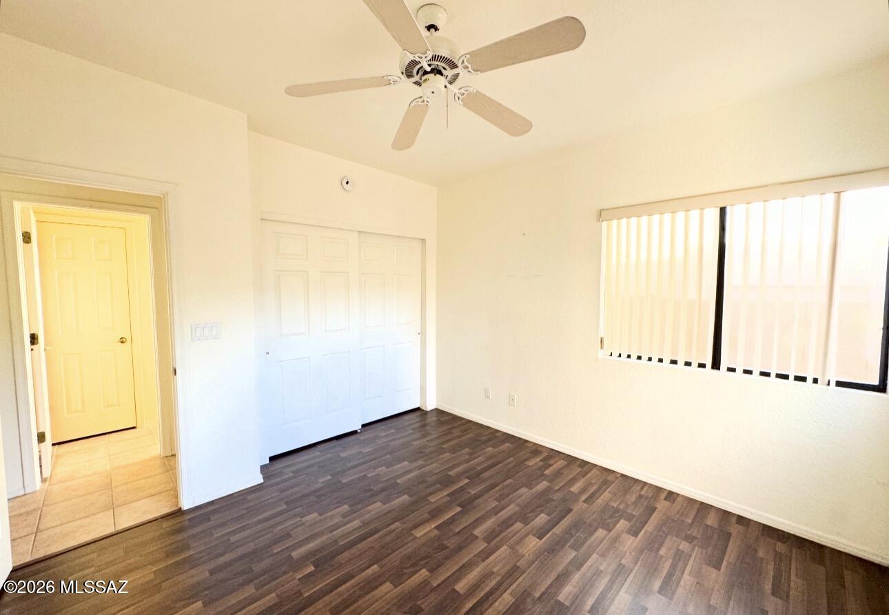 4998 North Valle Road Tucson, AZ 85750 - Photo 4 of 11 wooden floor in an empty room with a window