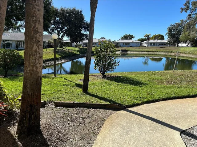 a kitchen with stainless steel appliances granite countertop a refrigerator and a stove