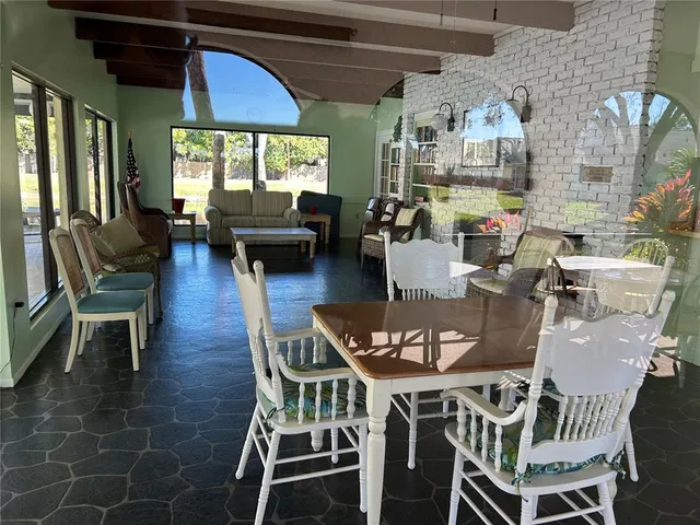 a view of hall way with furniture