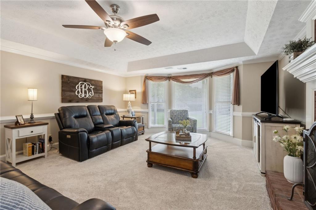 83 Russell Road Lawrenceville, GA 30043 - Photo 20 of 67 a living room with furniture and a flat screen tv