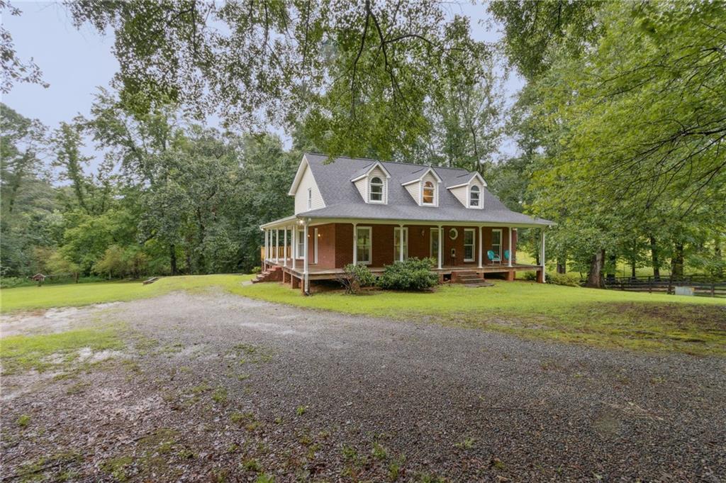 83 Russell Road Lawrenceville, GA 30043 - Photo 3 of 67 a front view of a house with a yard
