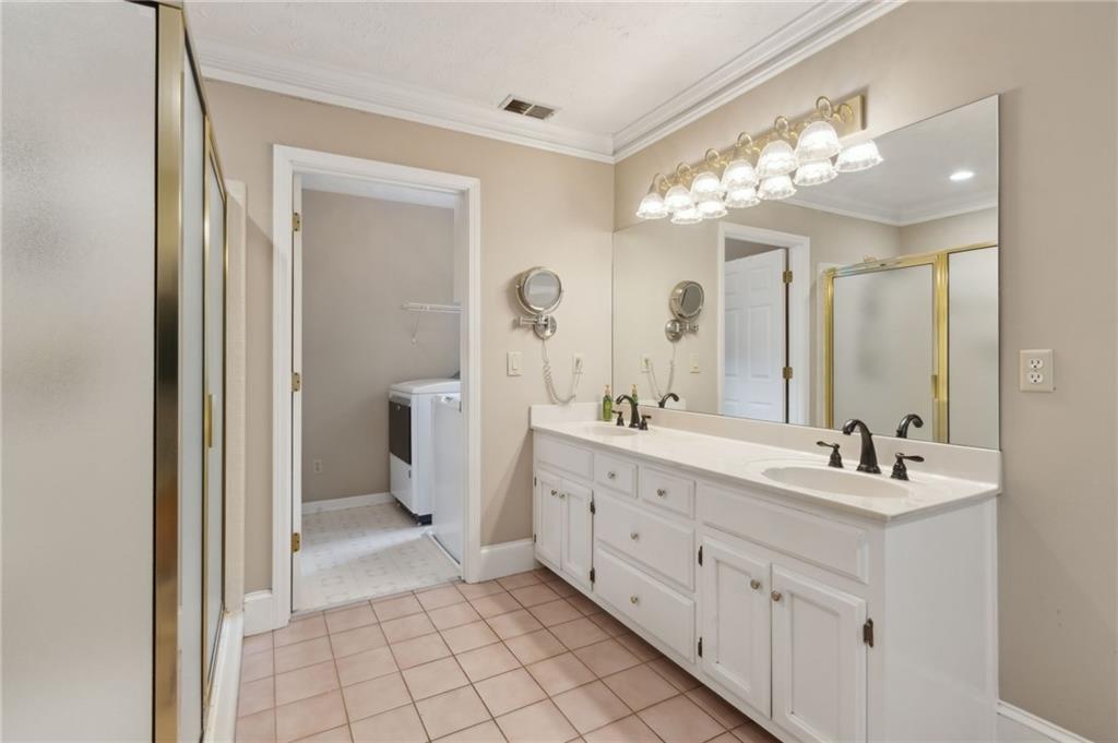 83 Russell Road Lawrenceville, GA 30043 - Photo 32 of 67 a spacious bathroom with a double vanity sink mirror and a