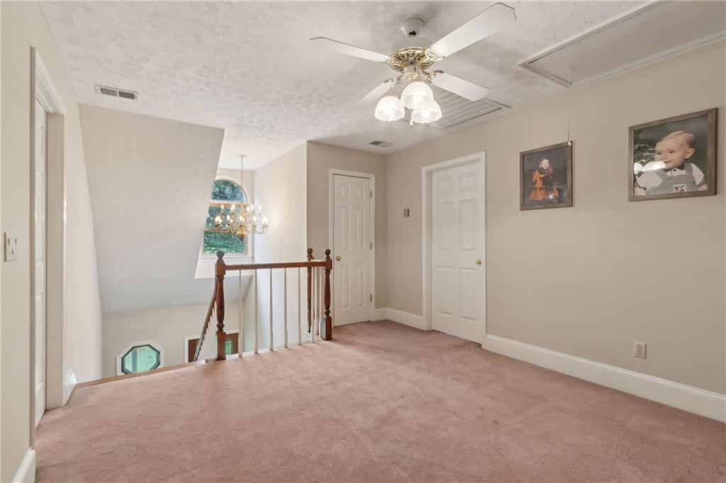 83 Russell Road Lawrenceville, GA 30043 - Photo 35 of 67 wooden floor in an empty room with a window