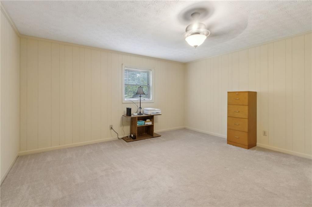 83 Russell Road Lawrenceville, GA 30043 - Photo 44 of 67 wooden floor in an empty room with a window