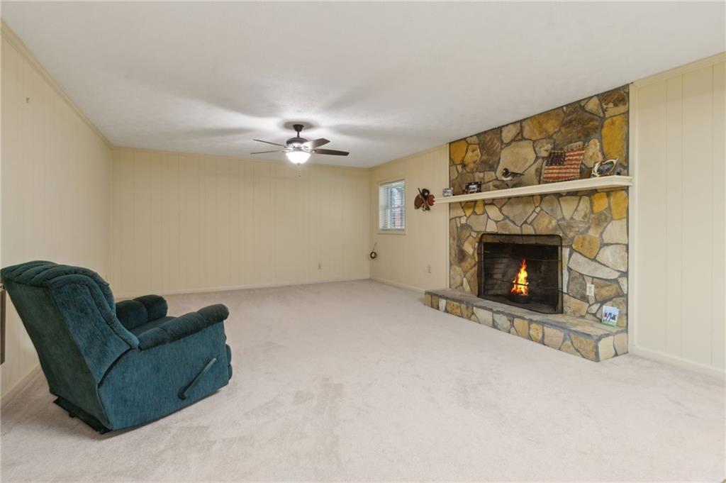 83 Russell Road Lawrenceville, GA 30043 - Photo 46 of 67 a living room with furniture and a fireplace