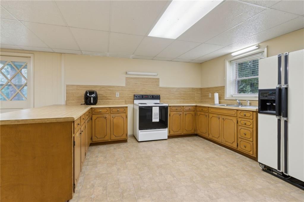 83 Russell Road Lawrenceville, GA 30043 - Photo 52 of 67 a kitchen with a stove top oven sink and cabinets