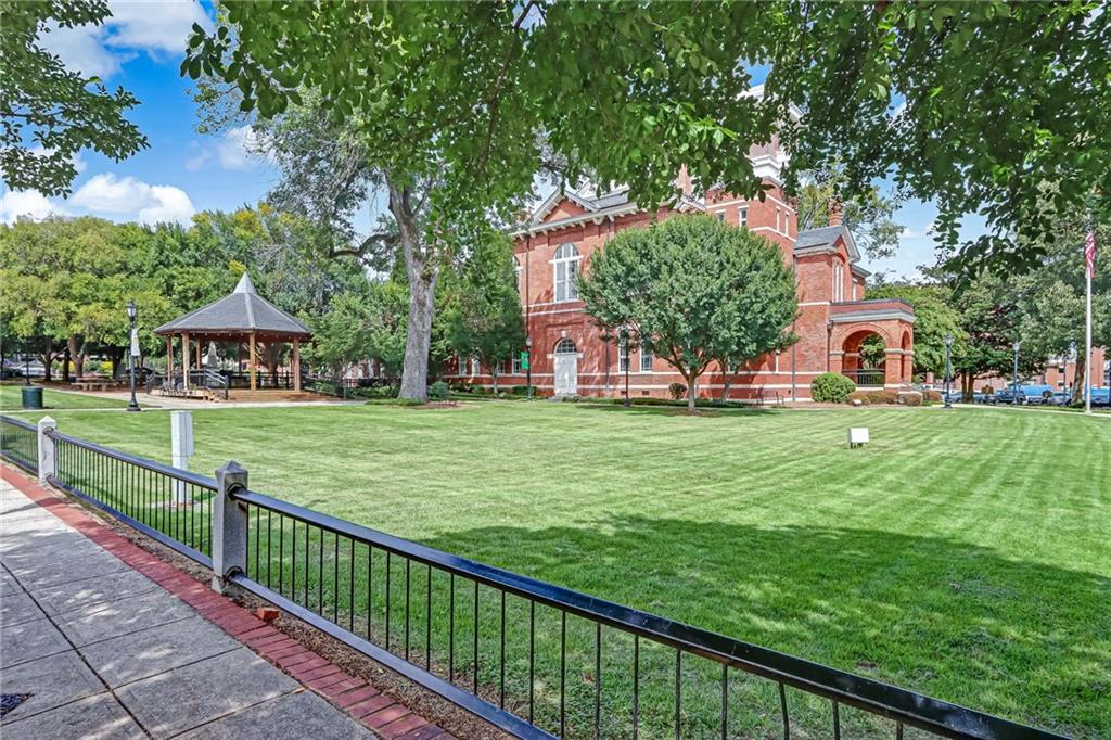 83 Russell Road Lawrenceville, GA 30043 - Photo 62 of 67 a view of a house with a big yard