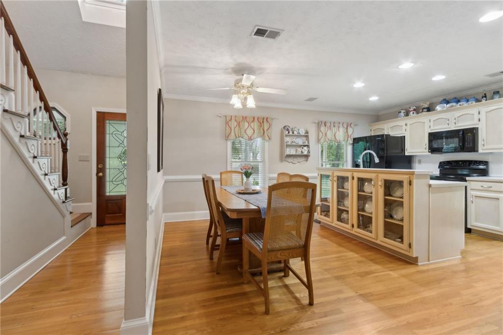 83 Russell Road Lawrenceville, GA 30043 - Photo 8 of 67 a view of a dining room with furniture window and wooden floor