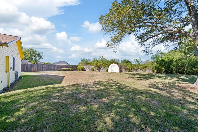 a view of swimming pool with a yard