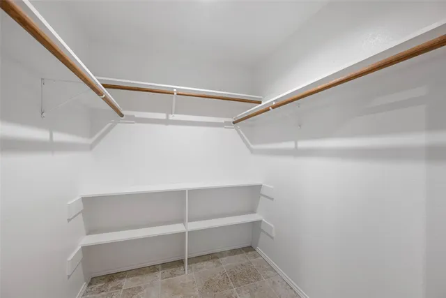 a view of an empty walk in closet