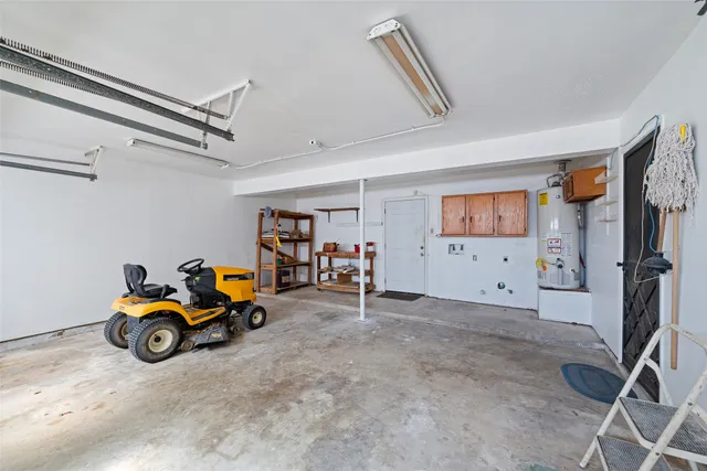 a view of a livingroom with toys and a ceiling fan