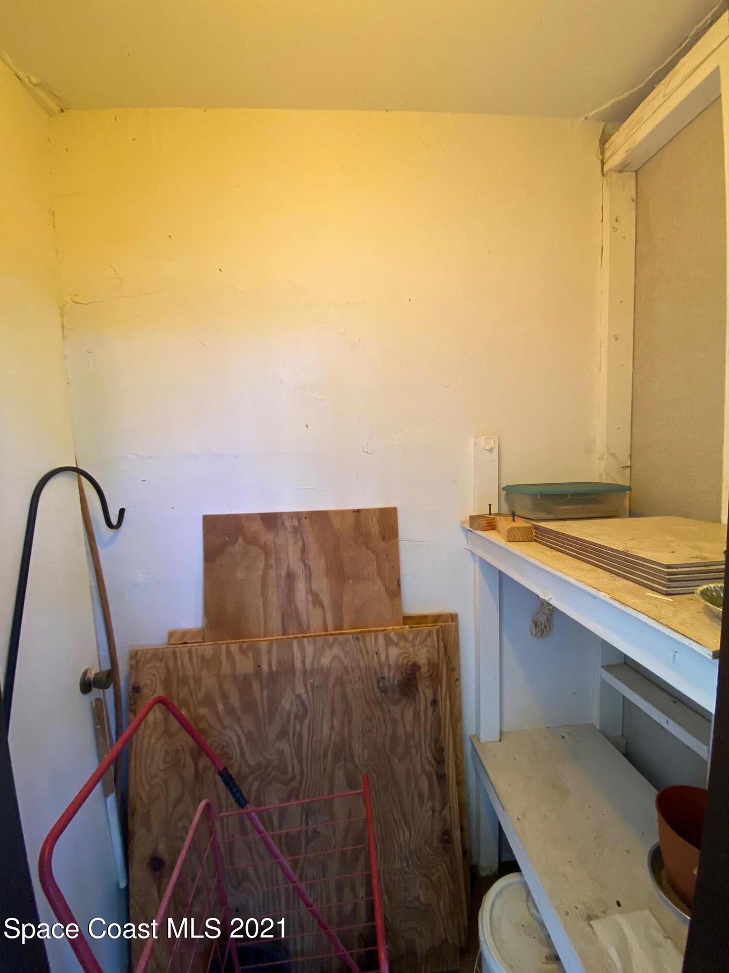 3135 Shady Dell Lane, Unit 112 Melbourne, FL 32935 - Photo 11 of 22 a bathroom with a sink mirror vanity and toilet
