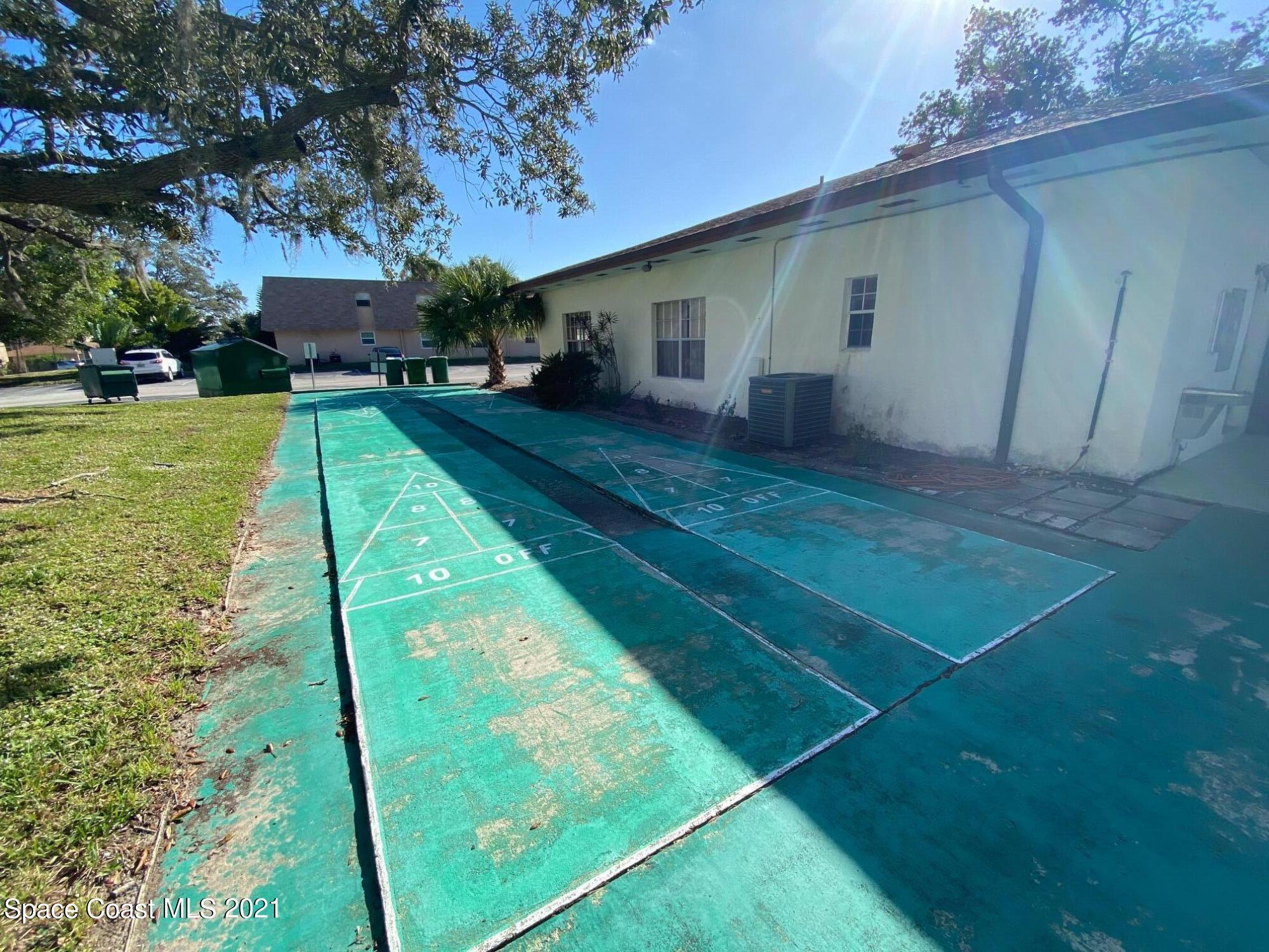 3135 Shady Dell Lane, Unit 112 Melbourne, FL 32935 - Photo 19 of 22 a view of a backyard with a garden