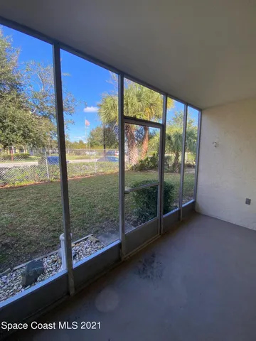 a view of a room with yard from a window