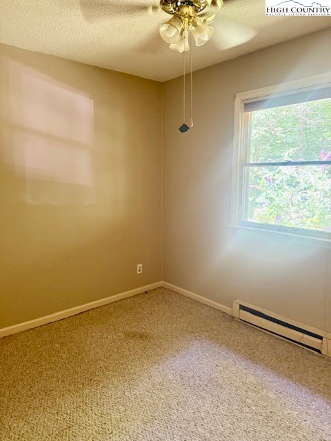 2202 Old 16 Highway Jefferson, NC 28640 - Photo 8 of 27 an empty room with a chandelier fan