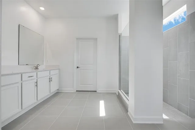a bathroom with a double vanity sink and mirror