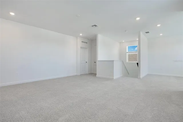 a view of empty room with windows