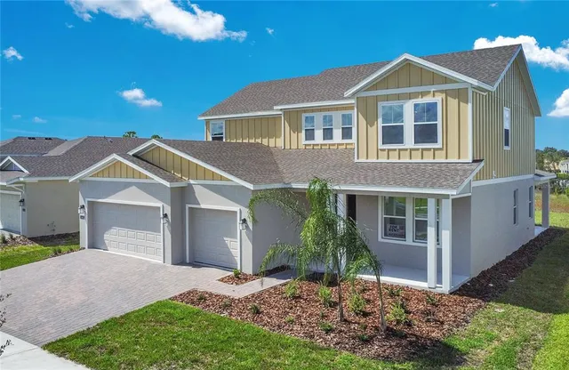 a front view of a house with a yard and porch