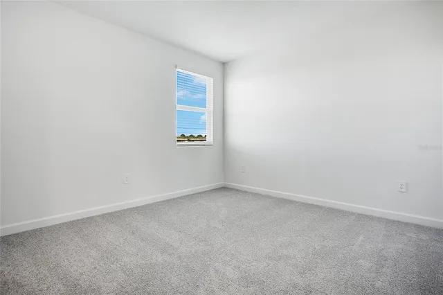 a view of an empty room with a ocean view